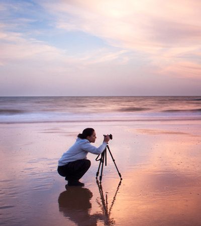 Photographer with tripod shooting a landscape in Doñana